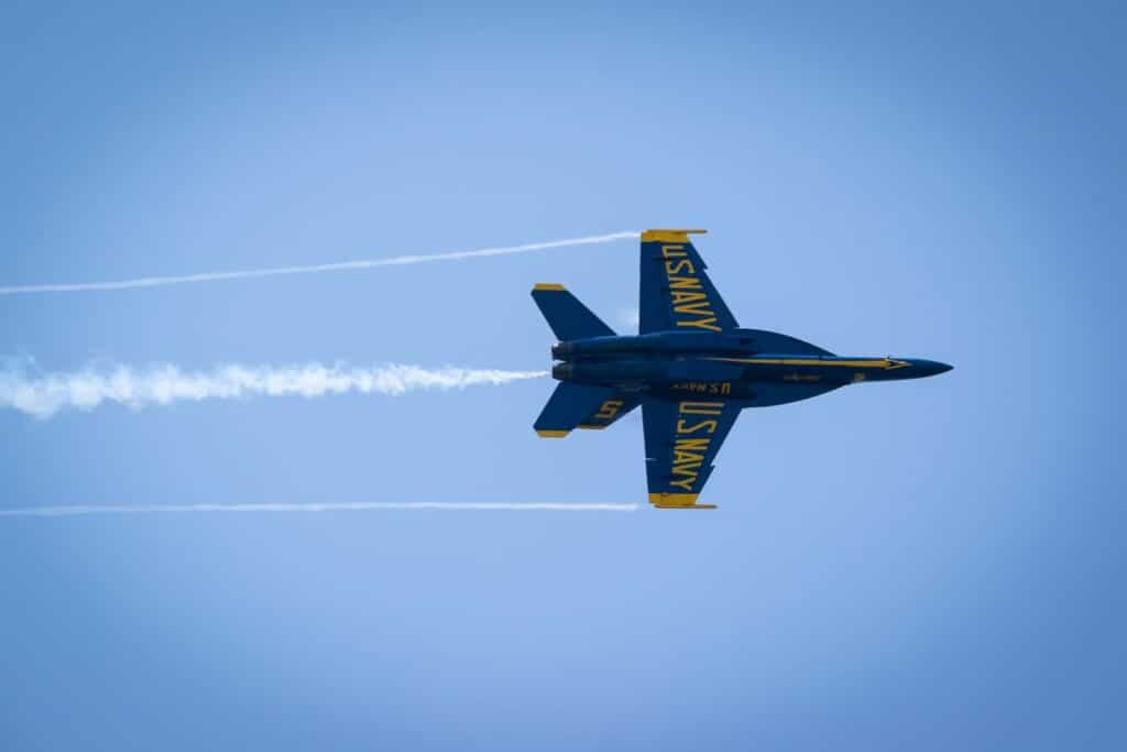 U.S. Naval Academy plane in the sky during an air show