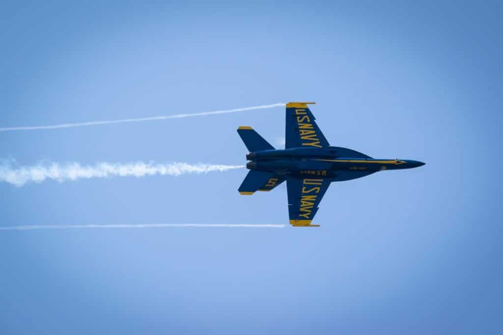 U.S. Naval Academy plane in the sky during an air show