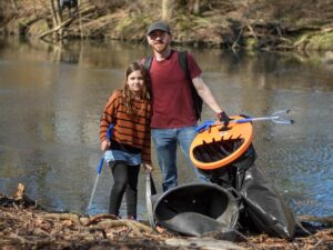 Volunteers in Montgomery County clean up litter along a waterway for the Pick Up PA program.